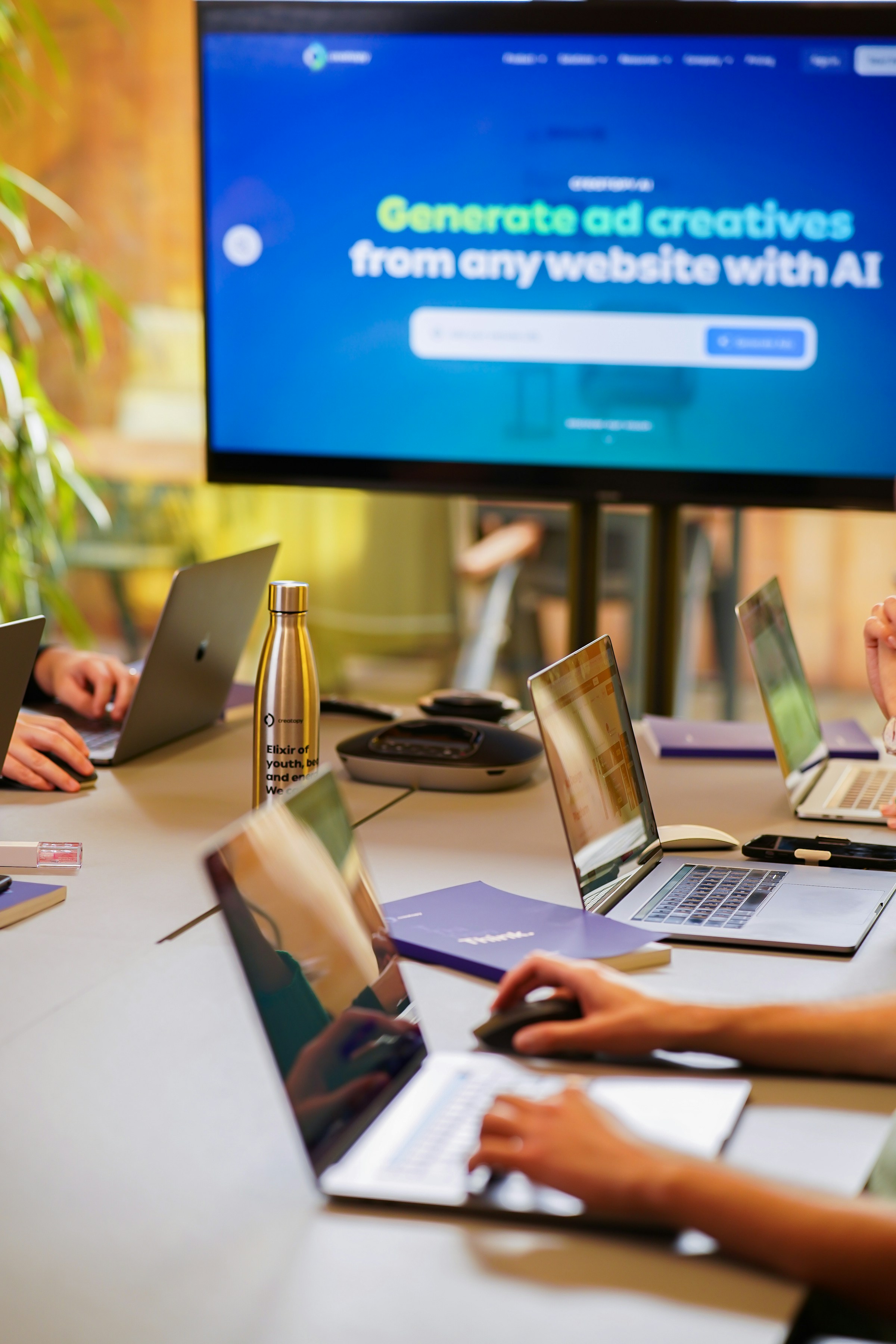 People evaluating technology around a table with laptops