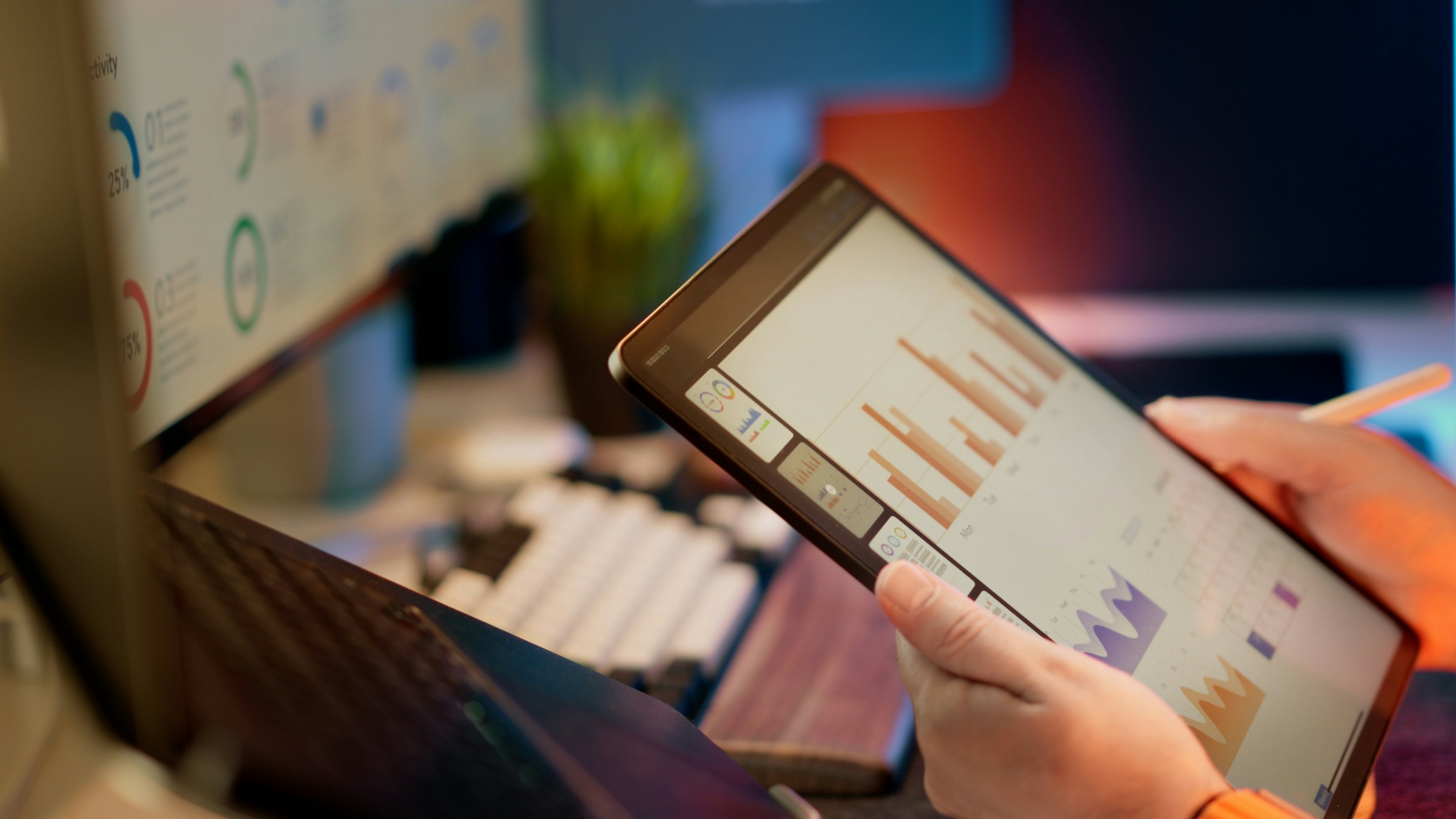 Person analyzing business data on a tablet