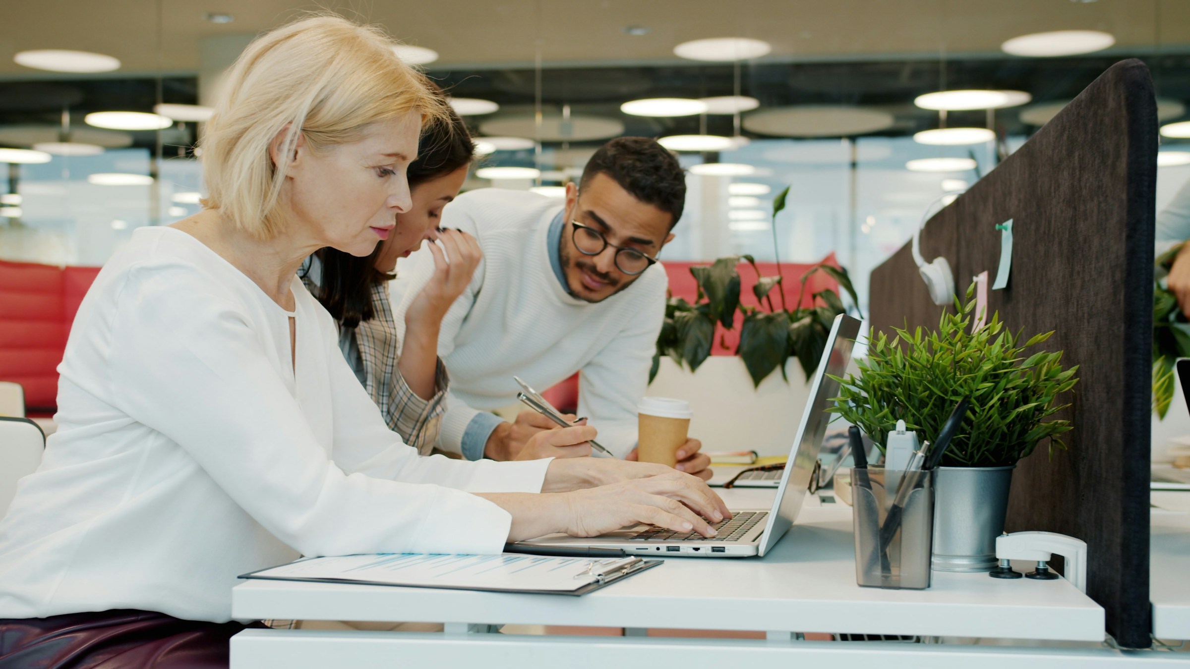Colleagues working together on laptops